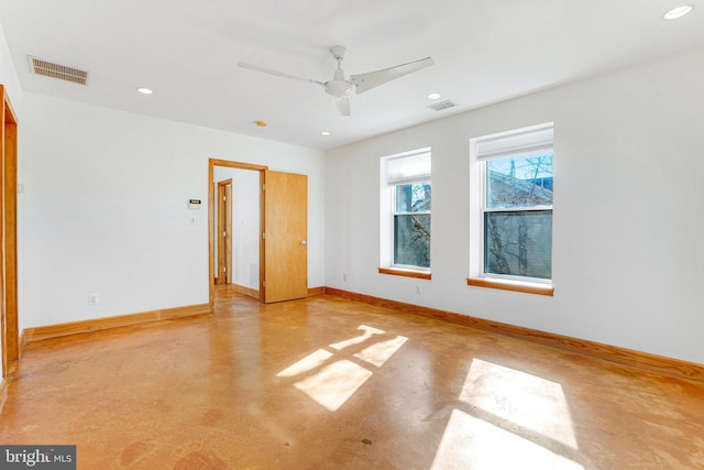 unfurnished bedroom with finished concrete flooring, baseboards, visible vents, and recessed lighting