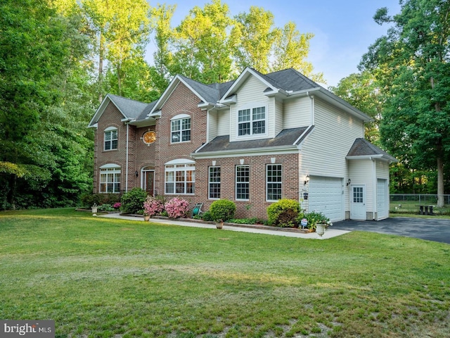 view of front facade featuring a garage and a front lawn