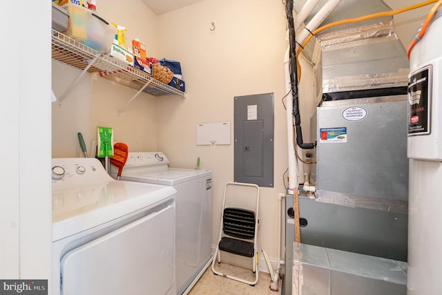 laundry area with heating unit, electric panel, and washing machine and clothes dryer