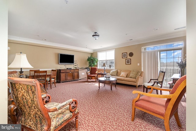 living room featuring crown molding and carpet flooring