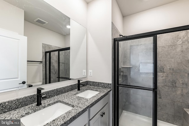 bathroom featuring vanity and walk in shower