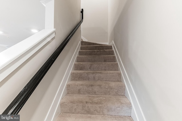 stairs with carpet flooring