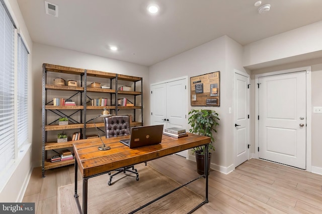 home office featuring light hardwood / wood-style floors