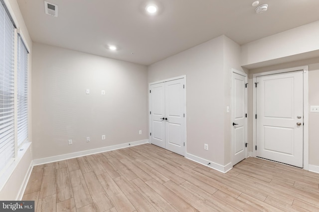 unfurnished bedroom with light hardwood / wood-style floors