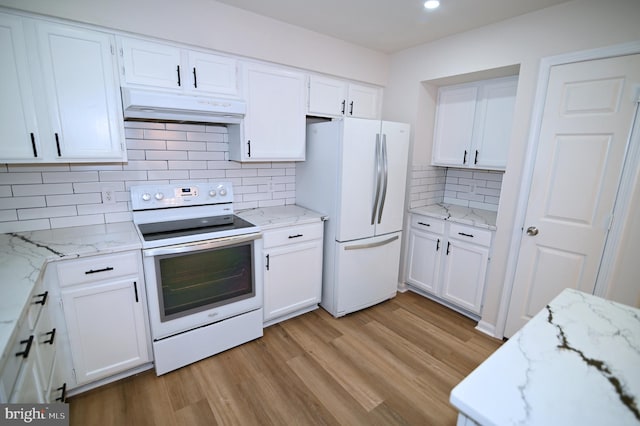 kitchen featuring white appliances and white cabinetry