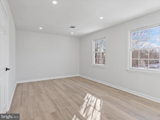 unfurnished room featuring light wood-type flooring