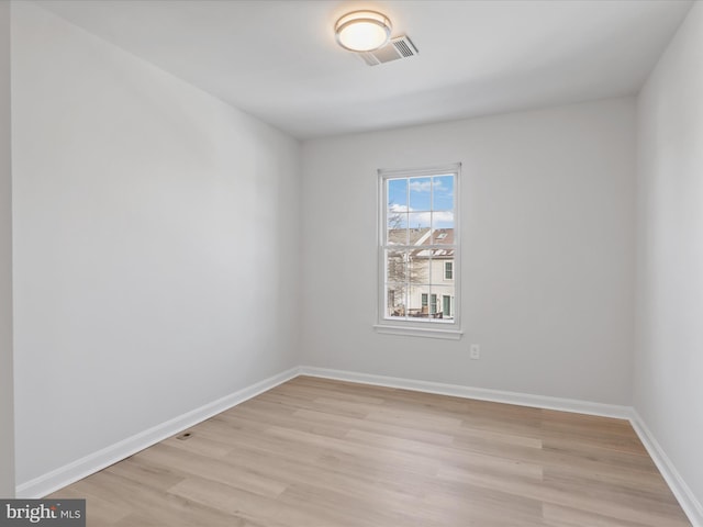 spare room featuring light hardwood / wood-style flooring