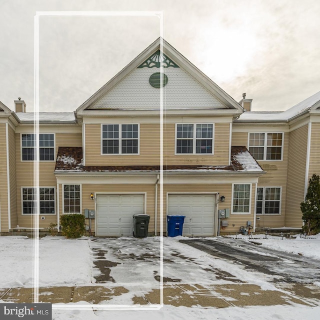 townhome / multi-family property featuring a garage