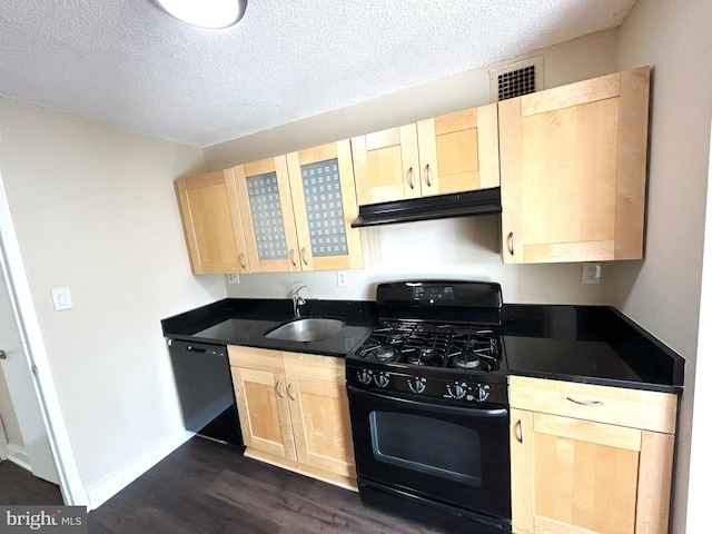 kitchen featuring black appliances, light brown cabinetry, a textured ceiling, and sink