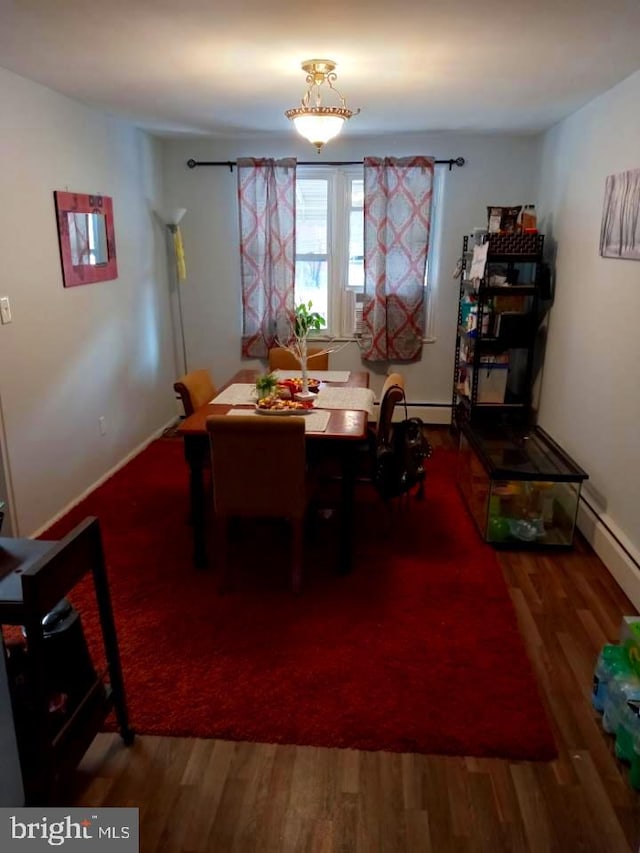 dining room with hardwood / wood-style floors