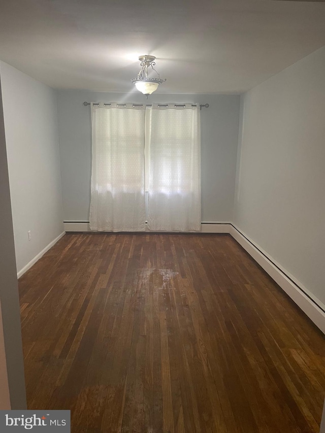 empty room featuring dark hardwood / wood-style floors