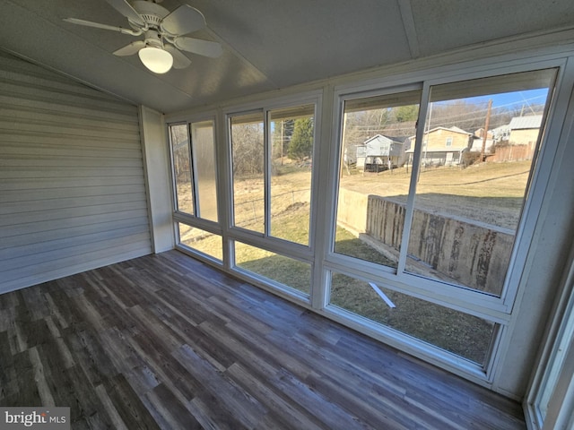 unfurnished sunroom with vaulted ceiling and ceiling fan