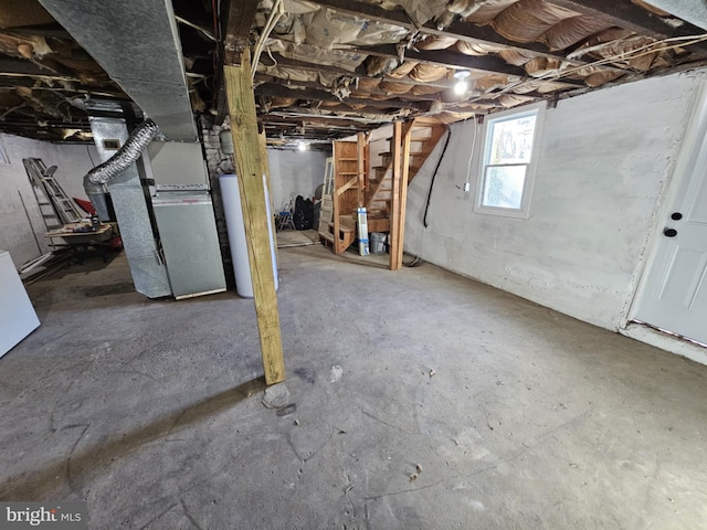 basement featuring heating unit and gas water heater