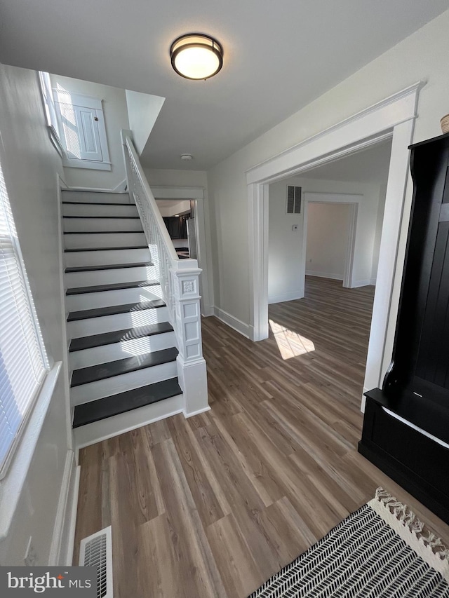 staircase featuring hardwood / wood-style flooring