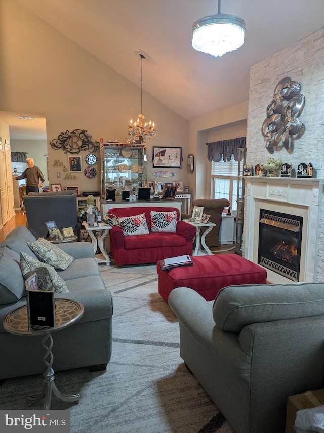 living room featuring a chandelier and vaulted ceiling