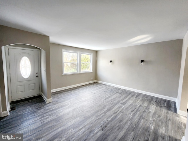 foyer entrance featuring dark hardwood / wood-style floors