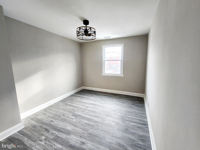 unfurnished room featuring hardwood / wood-style floors