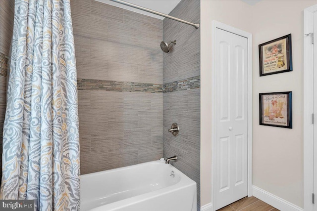 bathroom featuring shower / tub combo with curtain