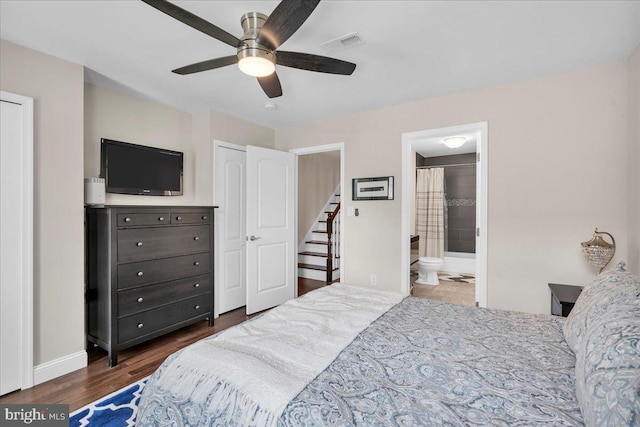 bedroom with dark hardwood / wood-style floors, connected bathroom, and ceiling fan