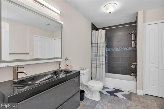 full bathroom with toilet, shower / tub combo, and vanity