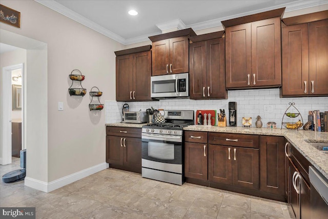 kitchen with crown molding, light stone countertops, decorative backsplash, dark brown cabinetry, and stainless steel appliances