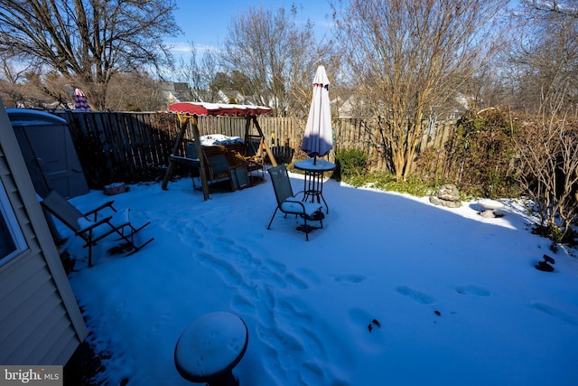 view of snow covered patio