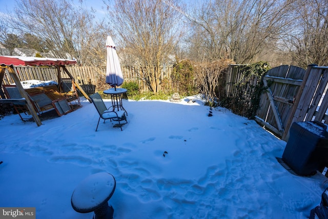 view of yard covered in snow