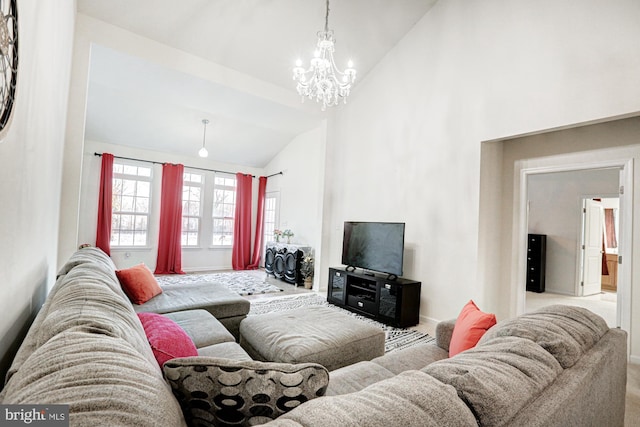 living room featuring an inviting chandelier and lofted ceiling