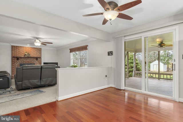 unfurnished living room featuring ornamental molding and hardwood / wood-style floors