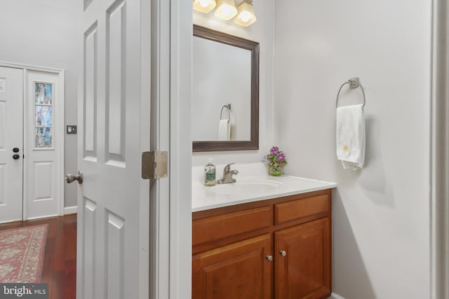 bathroom with hardwood / wood-style flooring and vanity