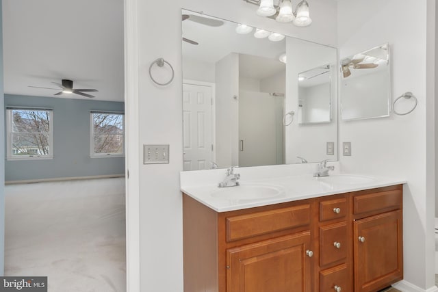 bathroom with ceiling fan and vanity