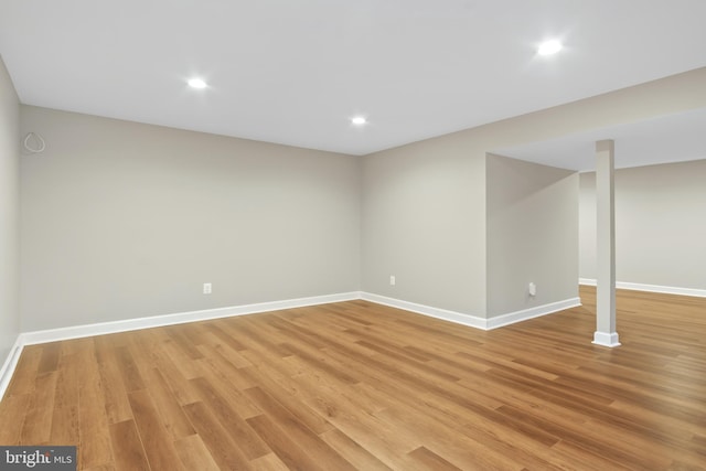 basement featuring light hardwood / wood-style floors