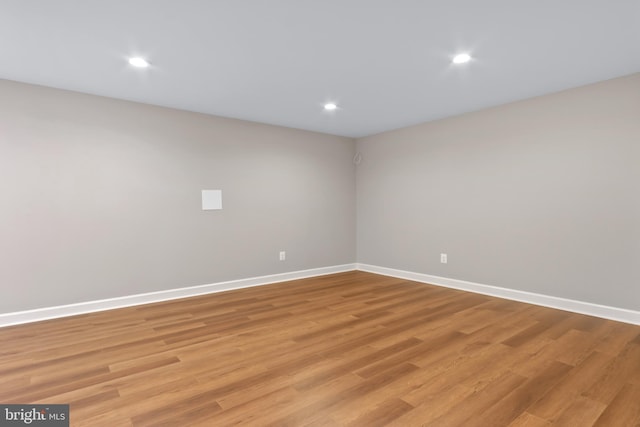 spare room with light hardwood / wood-style flooring