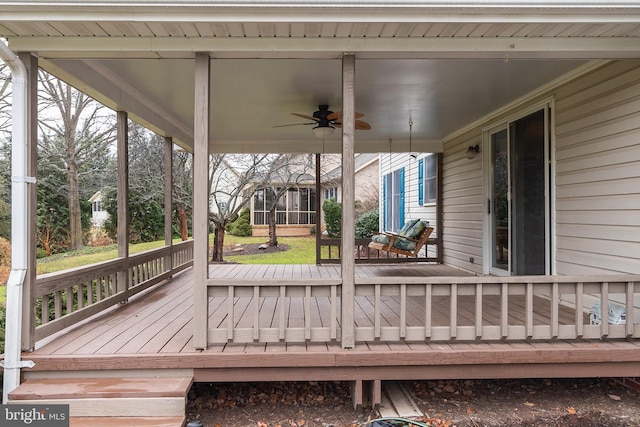 deck with ceiling fan and a porch