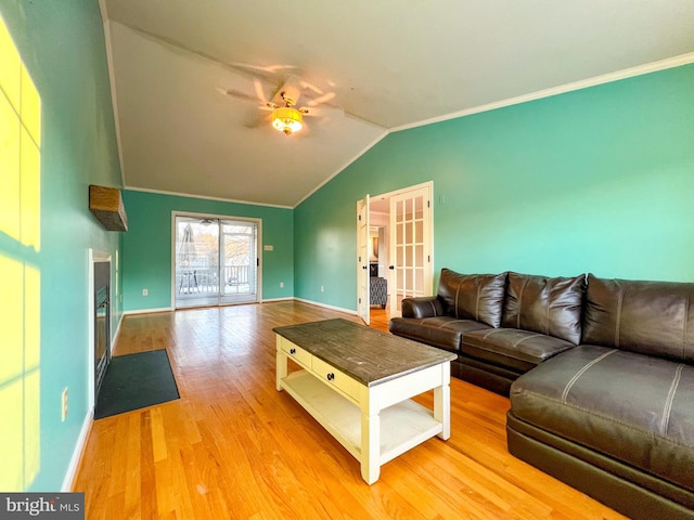 living room featuring ornamental molding, lofted ceiling, ceiling fan, and light hardwood / wood-style floors