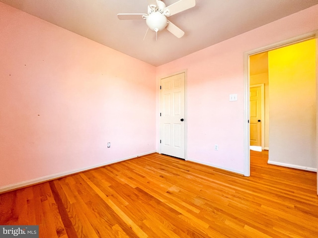 unfurnished bedroom featuring ceiling fan and wood-type flooring