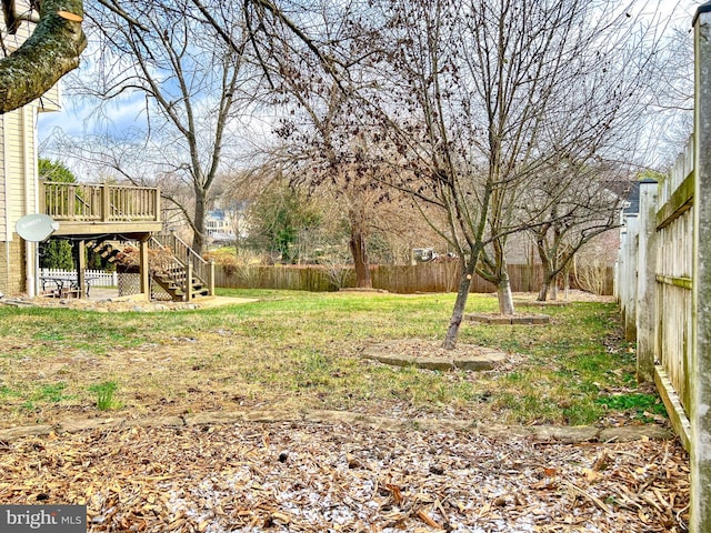 view of yard featuring a wooden deck