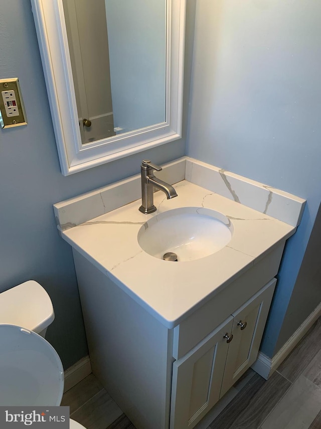 bathroom with vanity and toilet