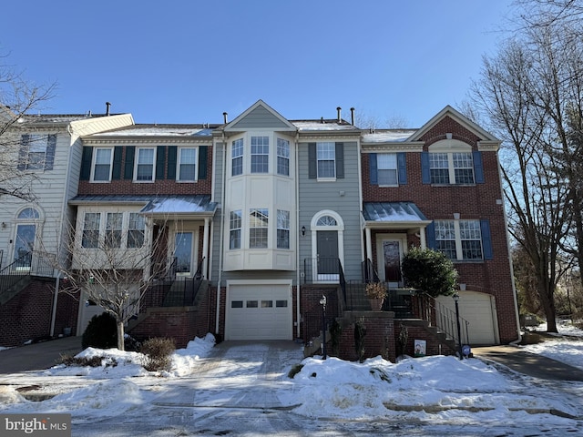 multi unit property featuring a garage