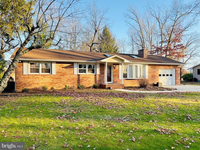 single story home with a garage and a front lawn