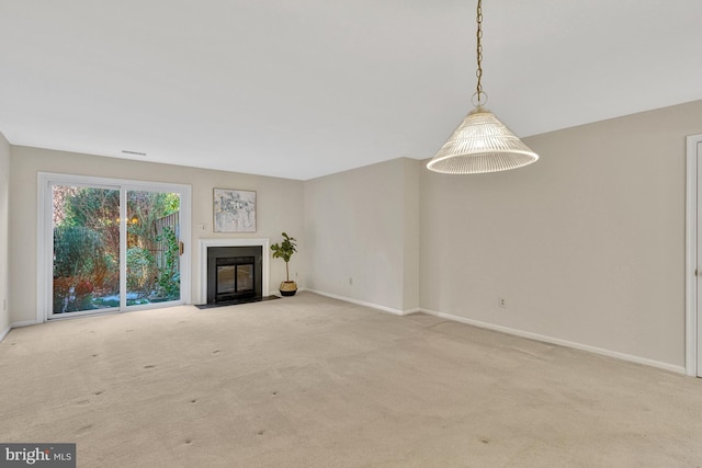 unfurnished living room with light carpet