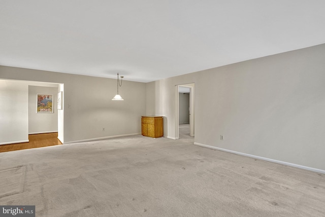 empty room with light colored carpet