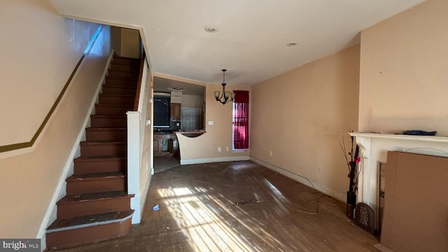 interior space with an inviting chandelier and dark wood-type flooring