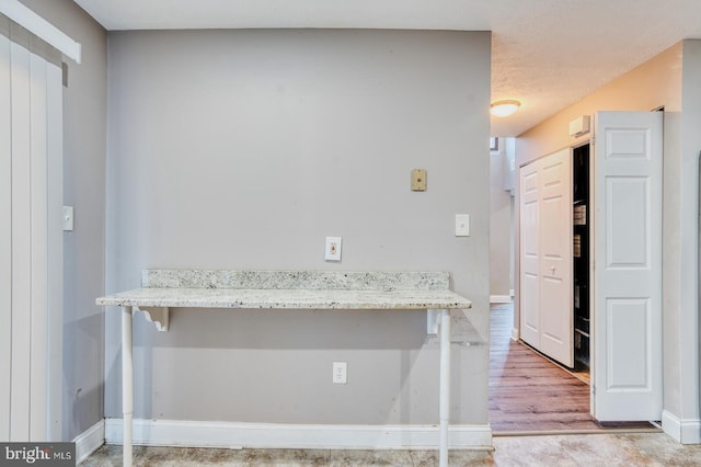 kitchen with light stone countertops and a kitchen breakfast bar