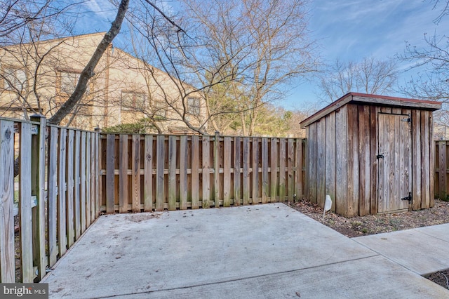 view of patio / terrace featuring a storage unit