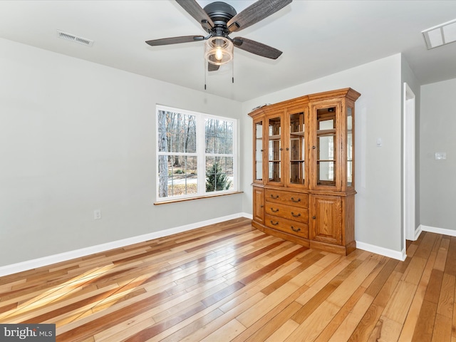 unfurnished room featuring ceiling fan and light wood-type flooring