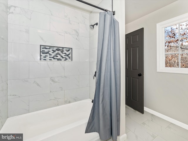 bathroom with shower / tub combo