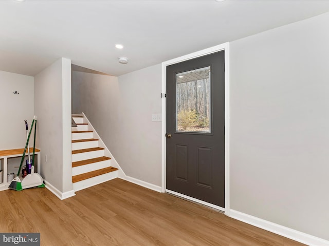 foyer entrance with light hardwood / wood-style flooring