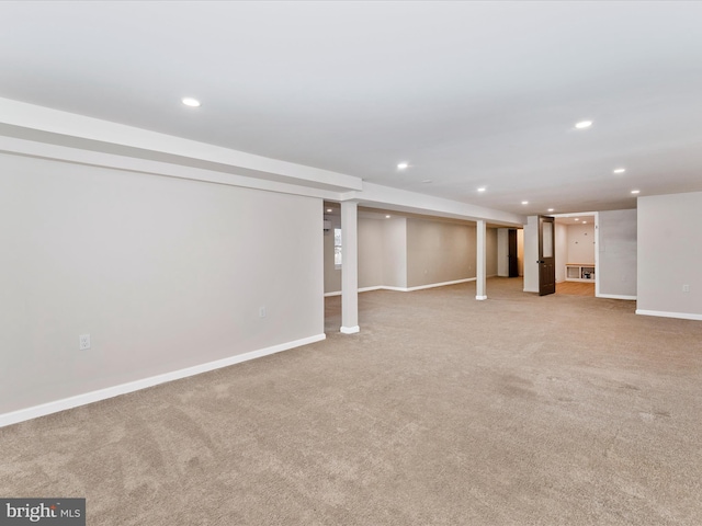 basement featuring light carpet