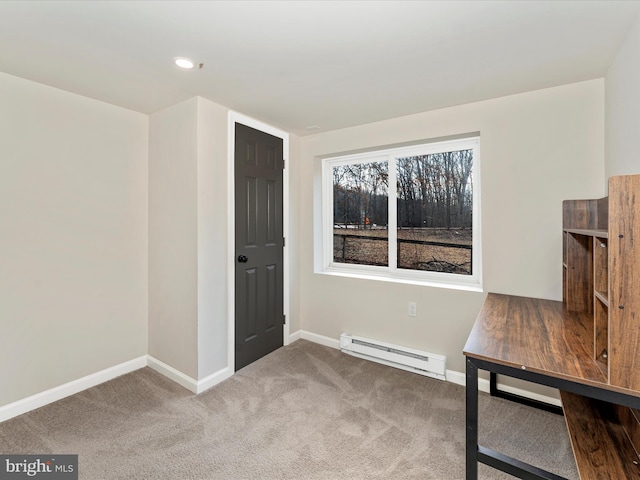 interior space featuring carpet floors and a baseboard heating unit